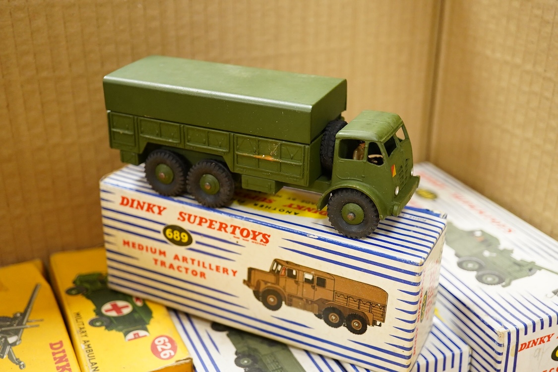 Fifteen boxed military Dinky Toys and Supertoys including; Recovery Tractor (661), 10-ton Army Truck (622), Military Ambulance (626), Army Water Tanker (643), etc. plus three unboxed vehicles, together with two Matchbox